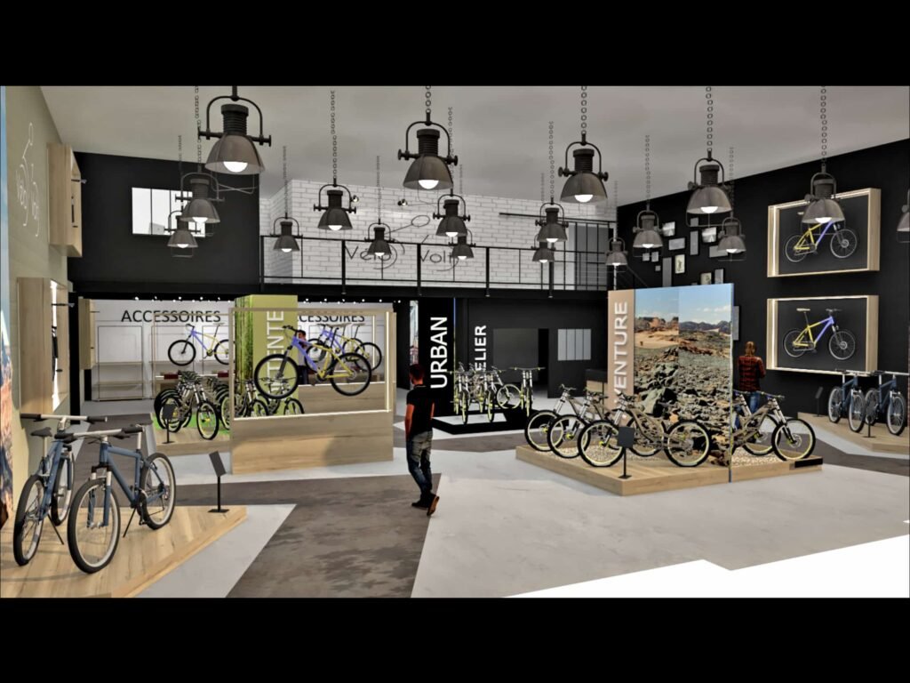 Intérieur d'un magasin de vélos moderne avec divers vélos en exposition, un éclairage industriel au plafond et de grands panneaux de catégorie tels que "Urban" et "Adventure". Une personne se tient près des présentoirs.