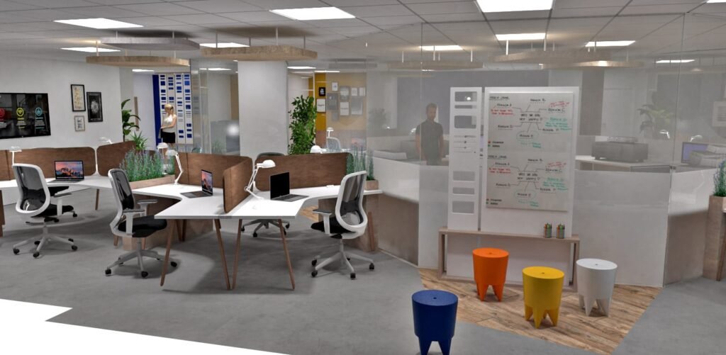 Bureau moderne à aire ouverte avec des bureaux, des chaises, des ordinateurs, un tableau blanc avec des notes, des tabourets colorés, des plantes en pot et des personnes travaillant à l'arrière-plan.