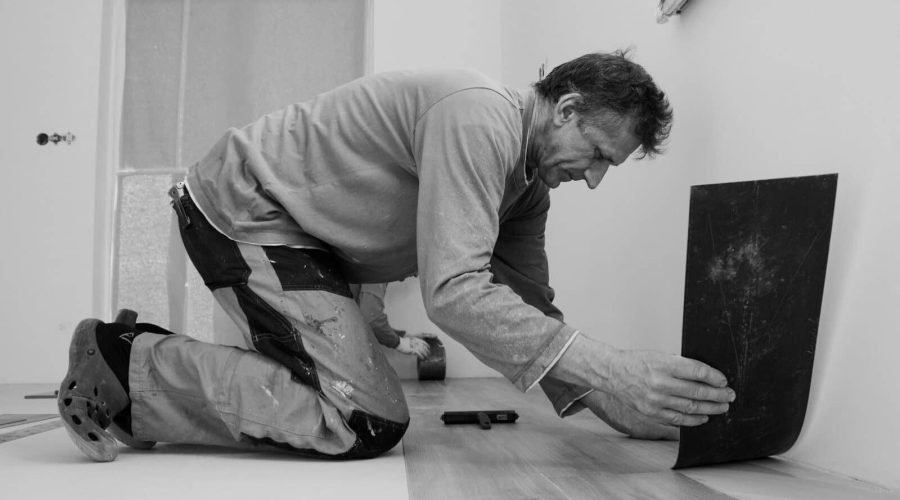 A man laying on the floor in a room